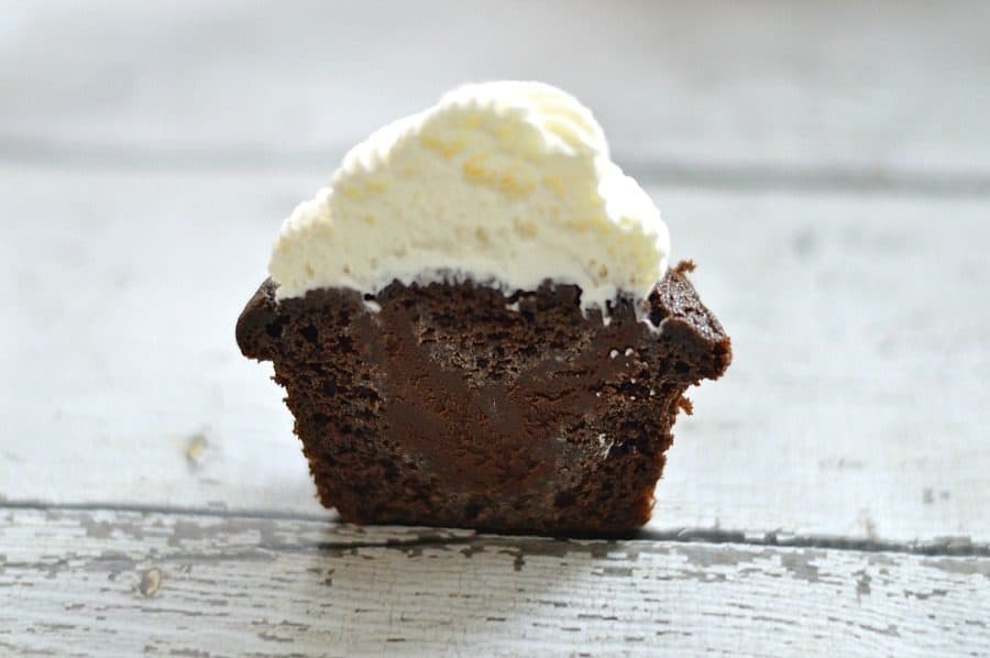 Moist chocolate cupcakes filled with a rich whiskey and chocolate ganache, topped with fresh whipped cream