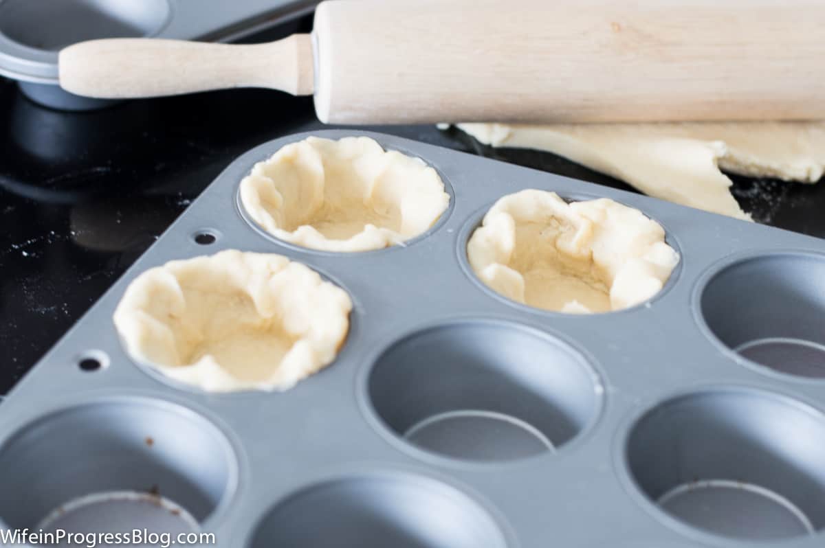 pie dough in a cupcake pan
