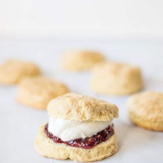 Irish scones on a plate filled with jam and cream