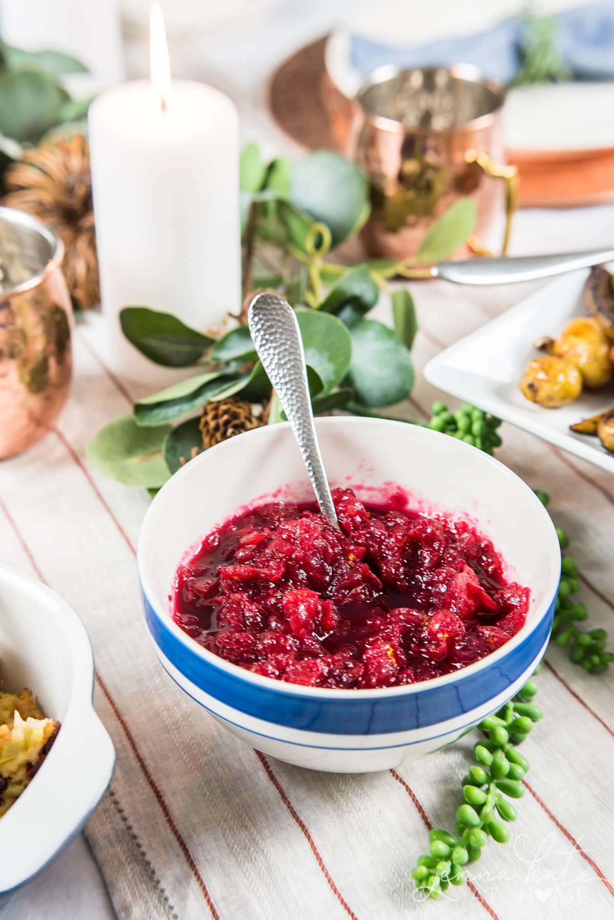 A bowl of cranberry sauce on a table 