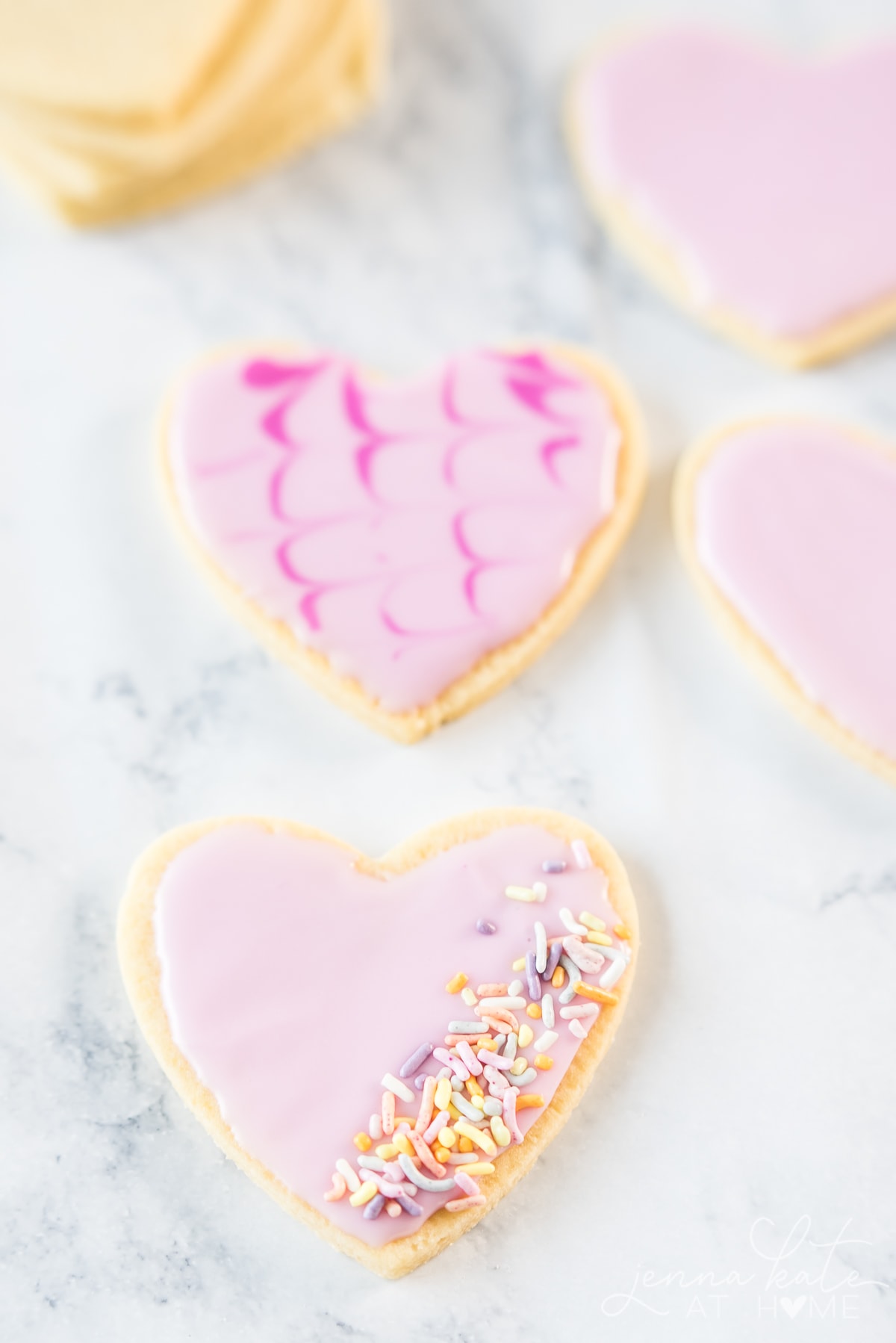 confectionary sugar icing recipe on heart shaped cookies