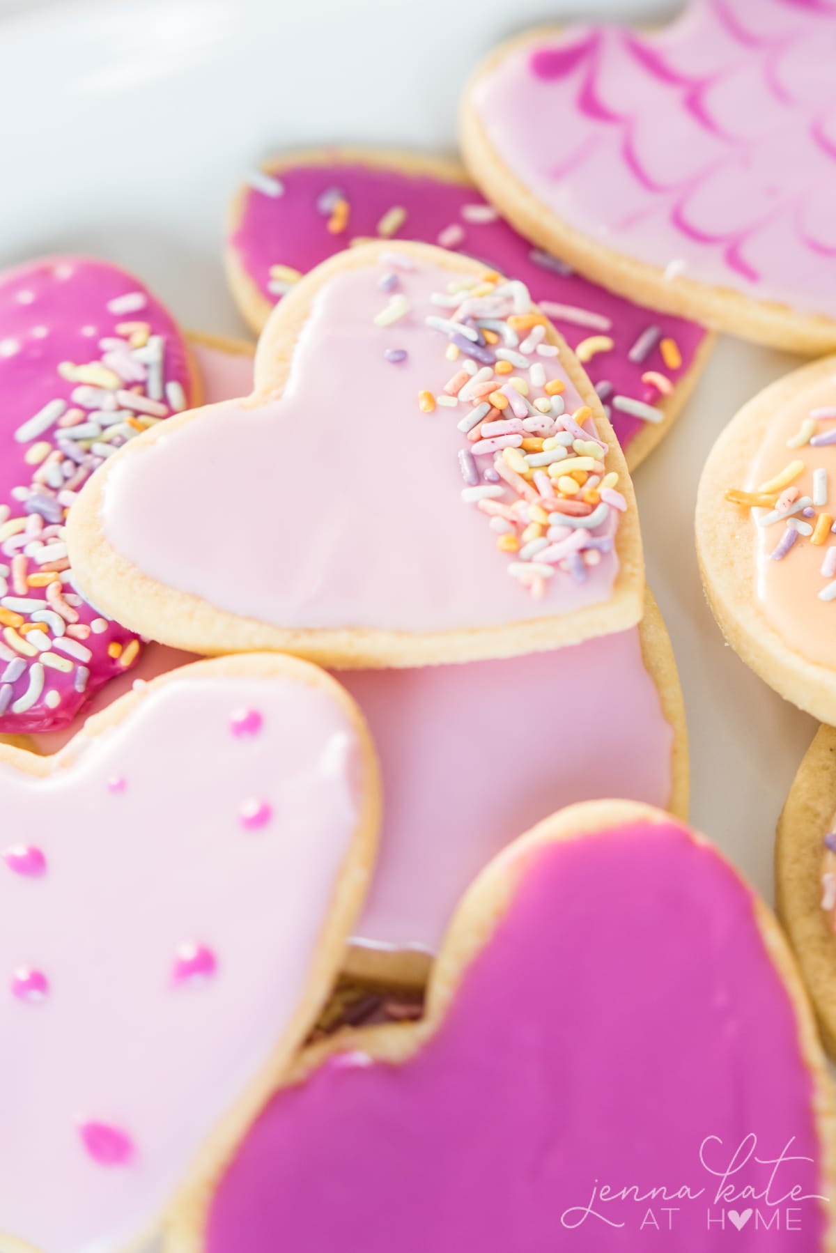 heart shaped cookies piled on a plate 