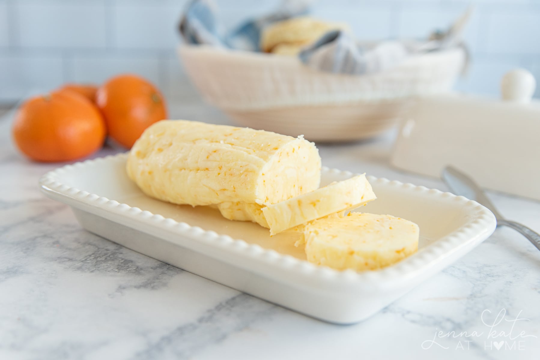 orange butter sliced on a butter dish