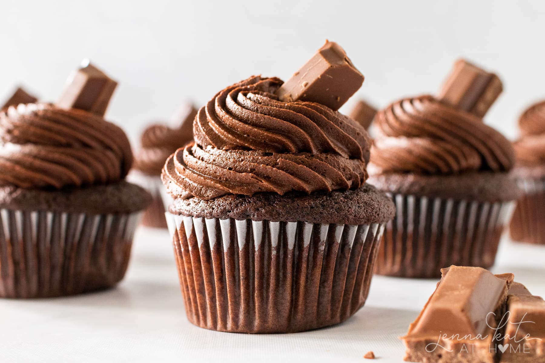 several chocolate cupcakes in a row