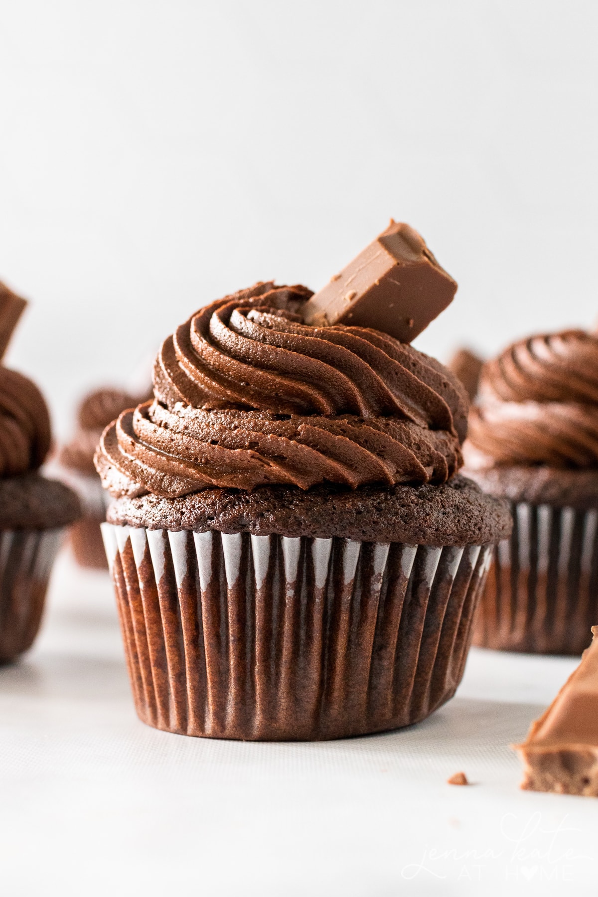 close up of a chocolate cupcake with chocolate buttercream frosting