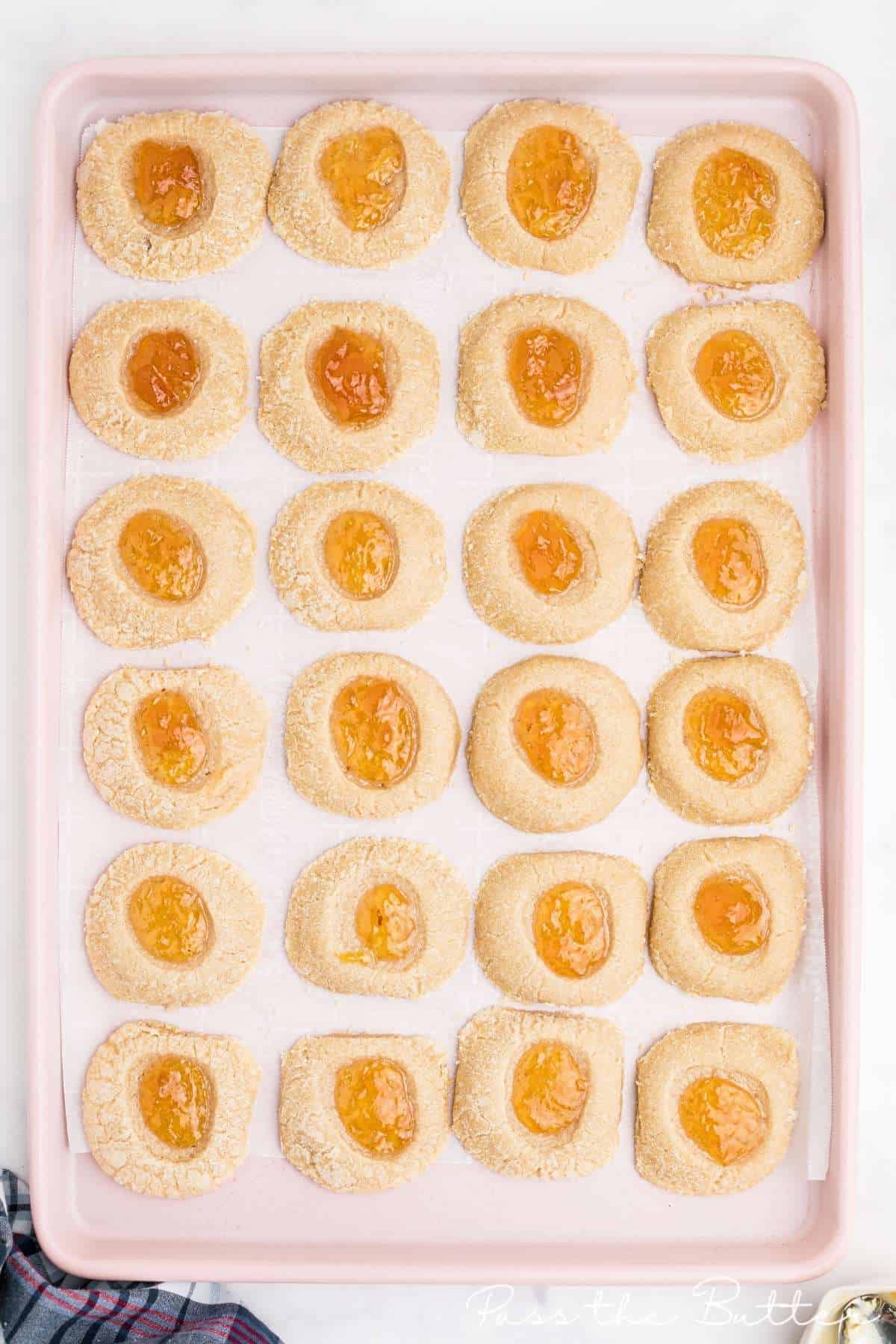 baking sheet with mango cookies laid out ready to bake