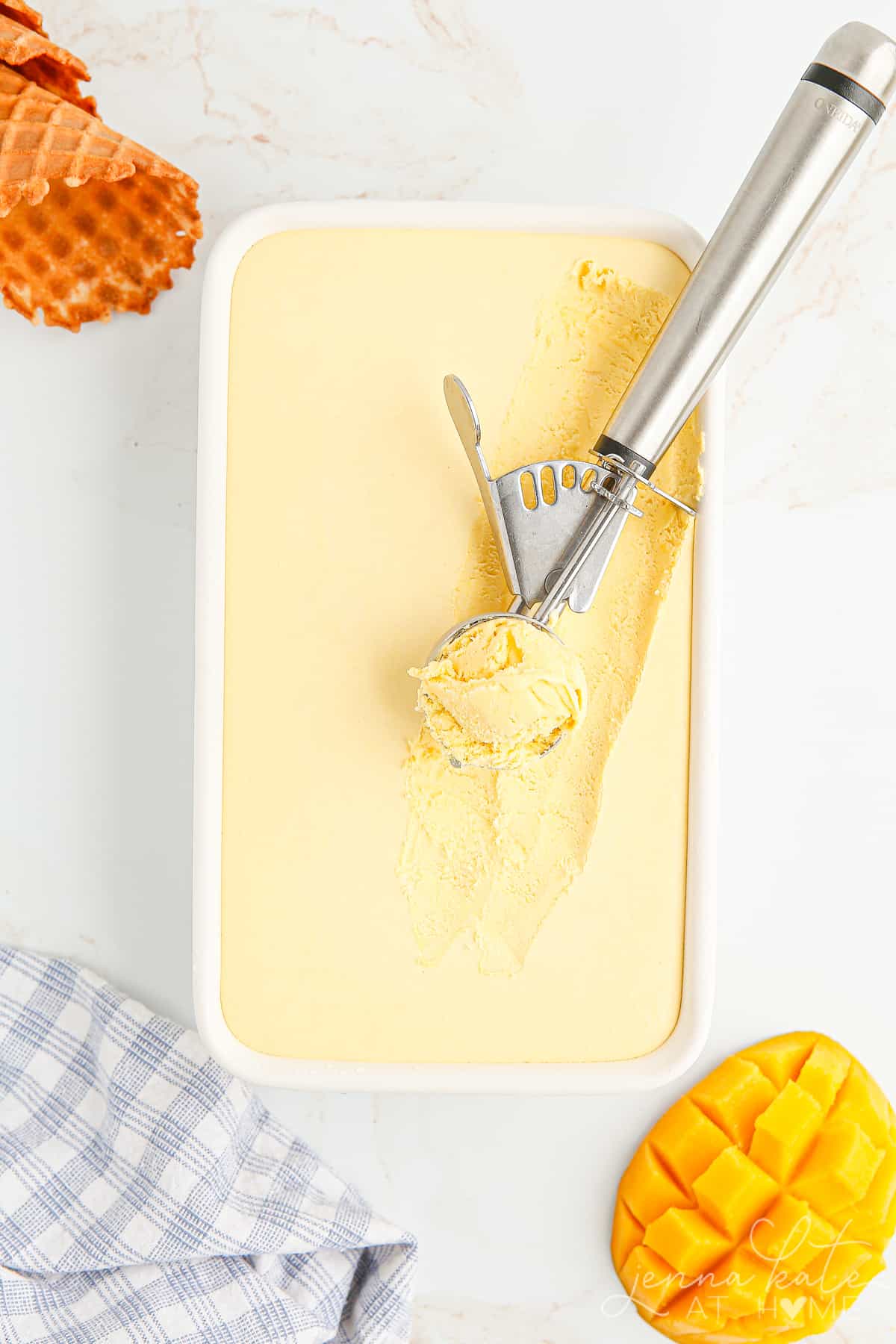 chilled mango ice cream with one scoop removed