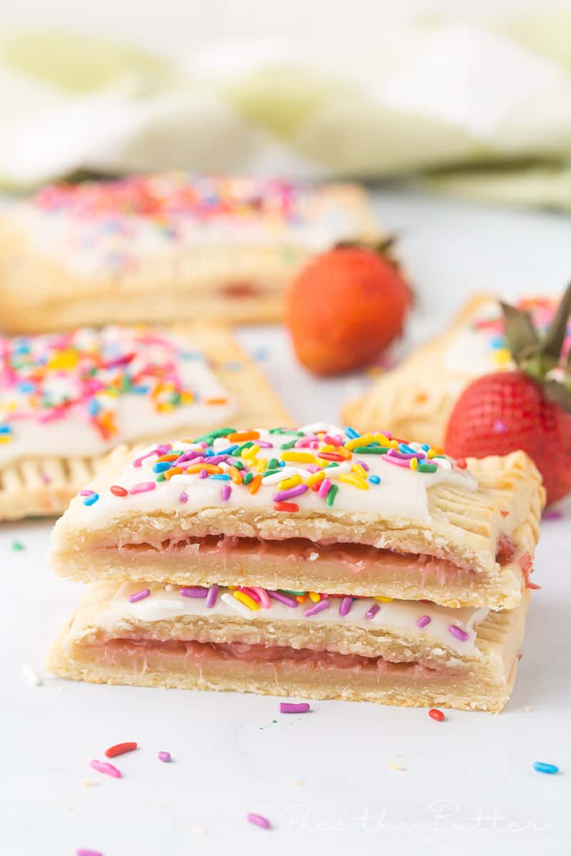 A strawberry pop tart cut in half showing the filling.
